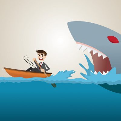 Businessman about to get eaten by shark